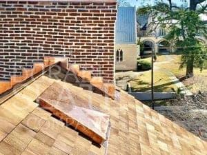 burgwin wright repaired roof with copper flashing on historic chimney