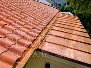 repaired copper gutters, spanish red clay roofing tile, and copper standing seam roof in south carolina