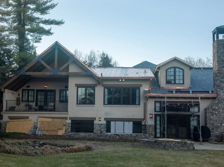 a slate roofed house with standing seam copper rooftop in Potomac, Maryland