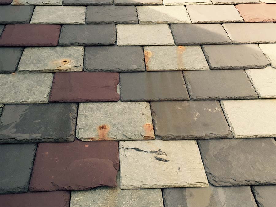 example of chinese multicolored slate rusting out after only five years of roof use