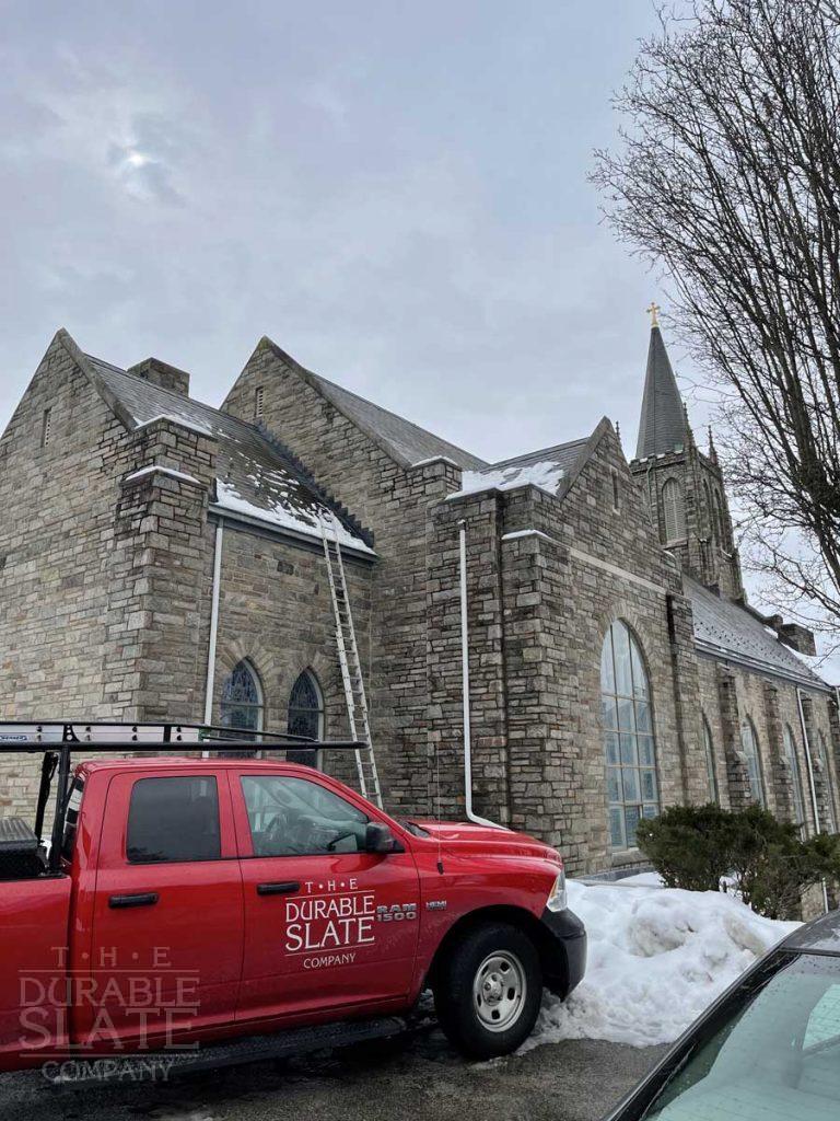 a car parked in front of a brick building