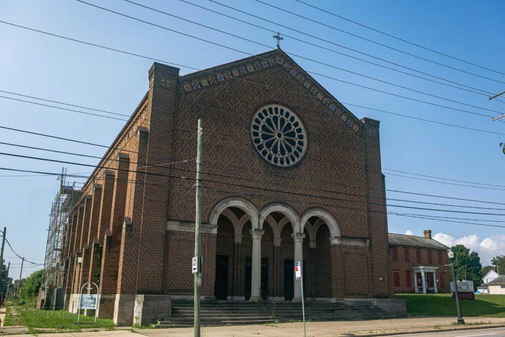 a church in the corner of a street