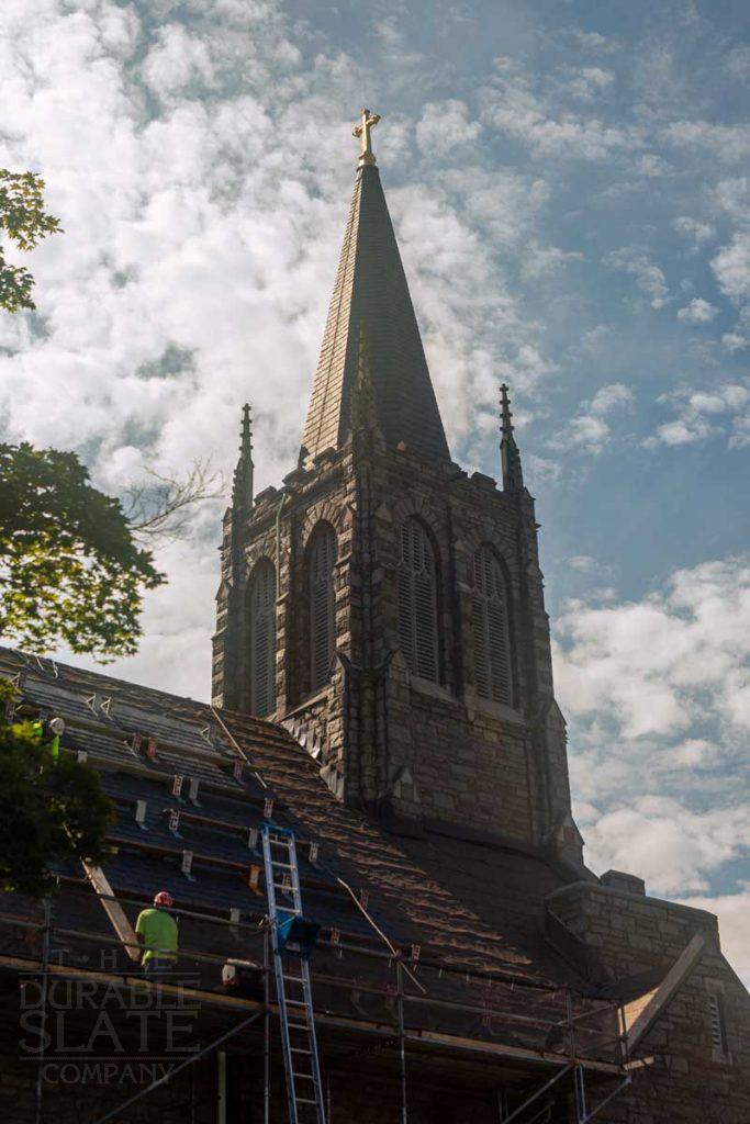 a large tall tower with a clock at the top of a building