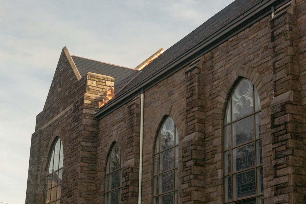 a large brick building with a clock tower