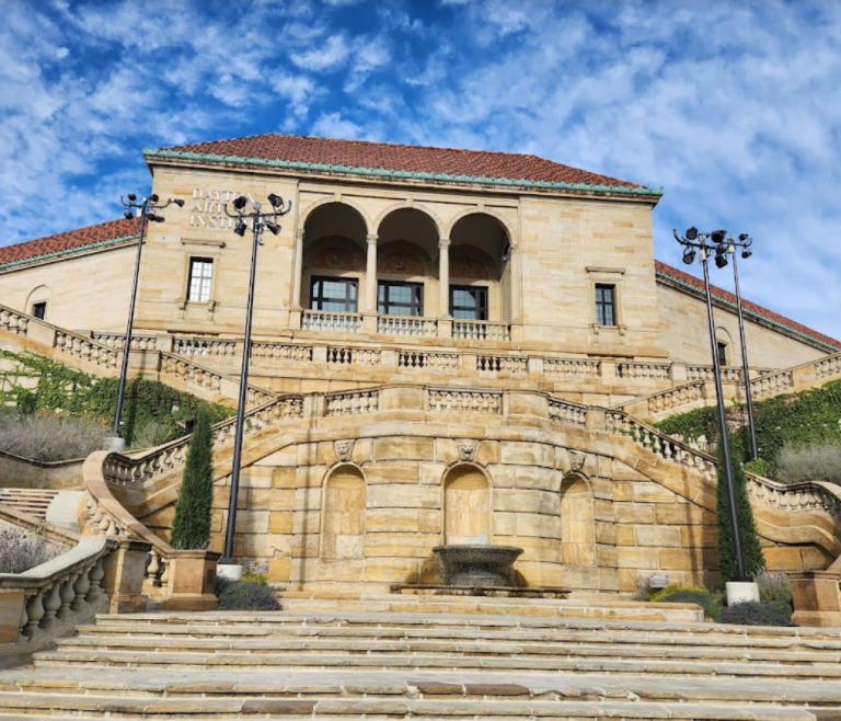 a large stone building with Dayton Art Institute in the background