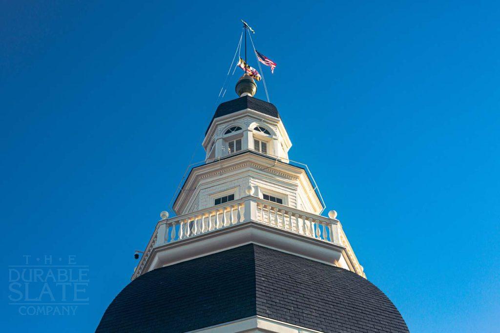 a large tall tower with a clock at the top of a building