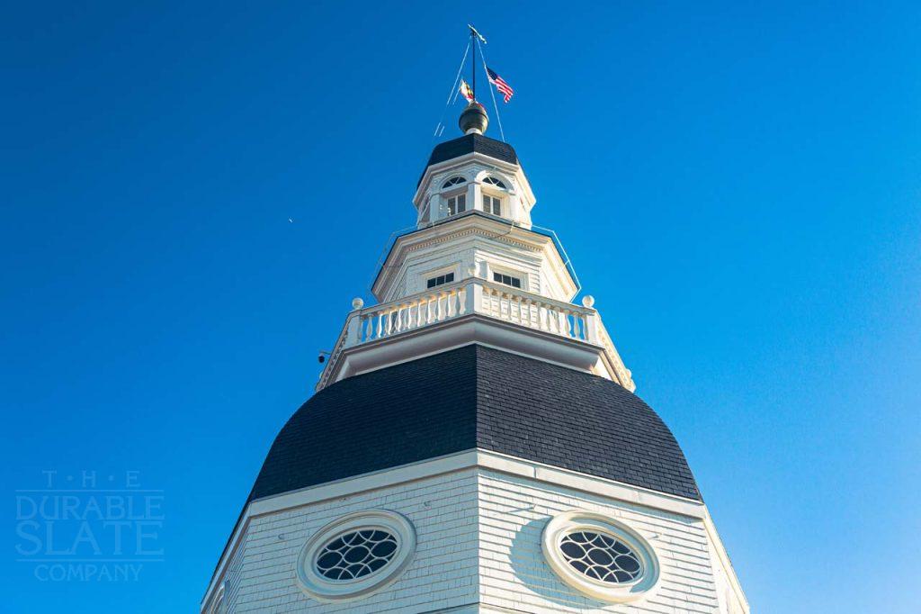 a large tall tower with a clock at the top of a building