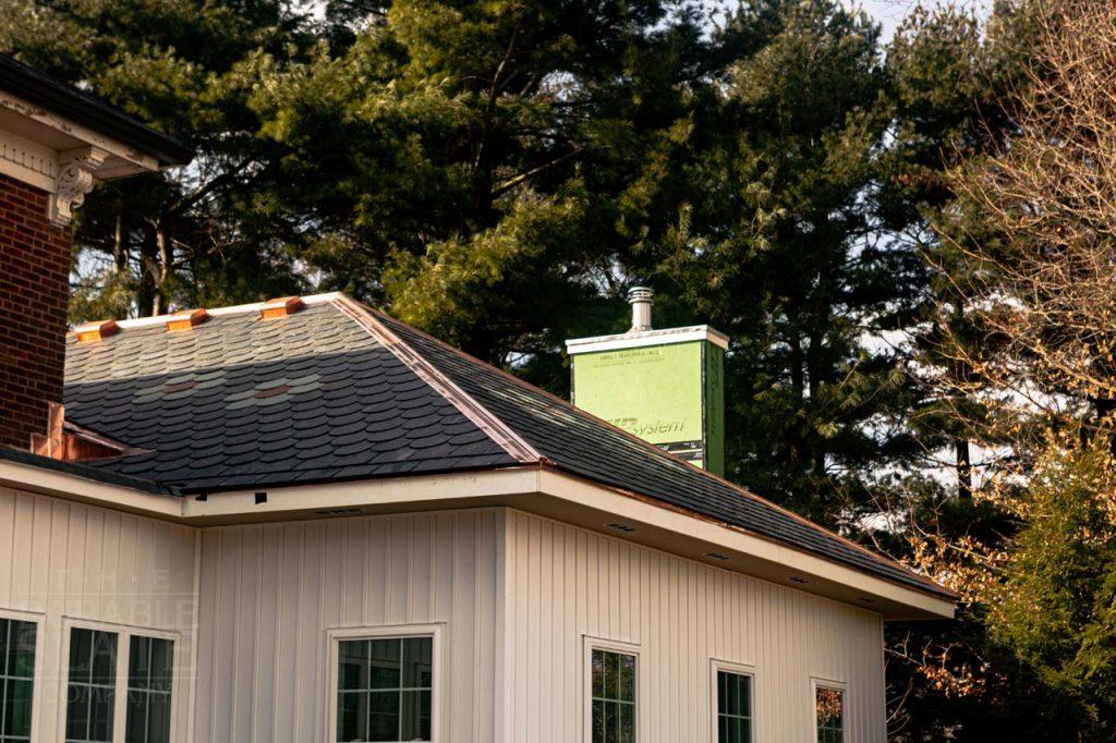 a house with trees in the background