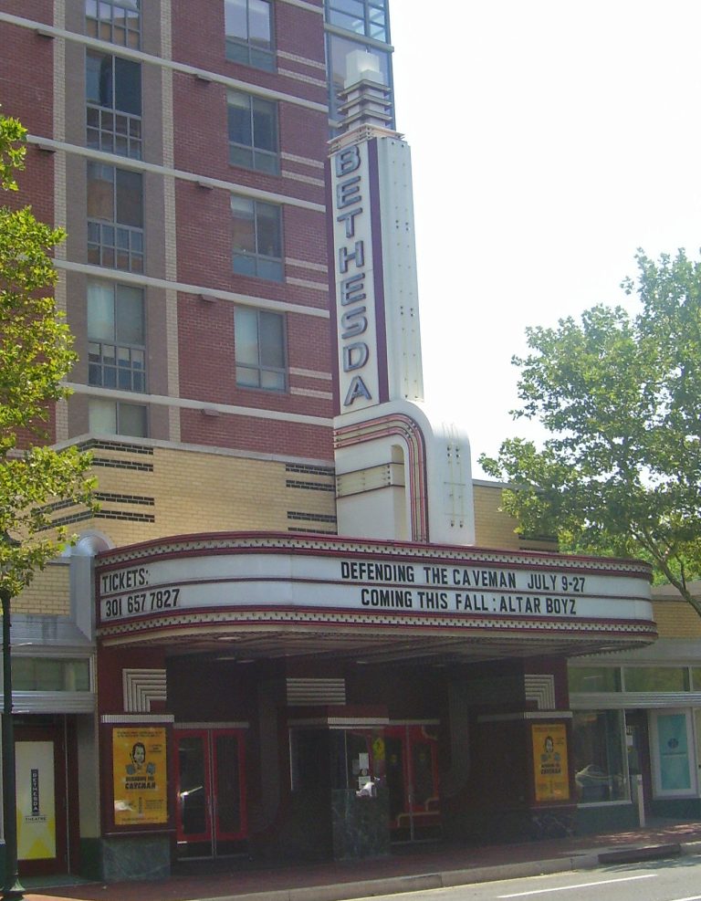 a sign above a store in a brick building