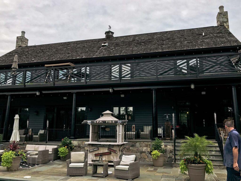 a group of people standing in front of Gamble House