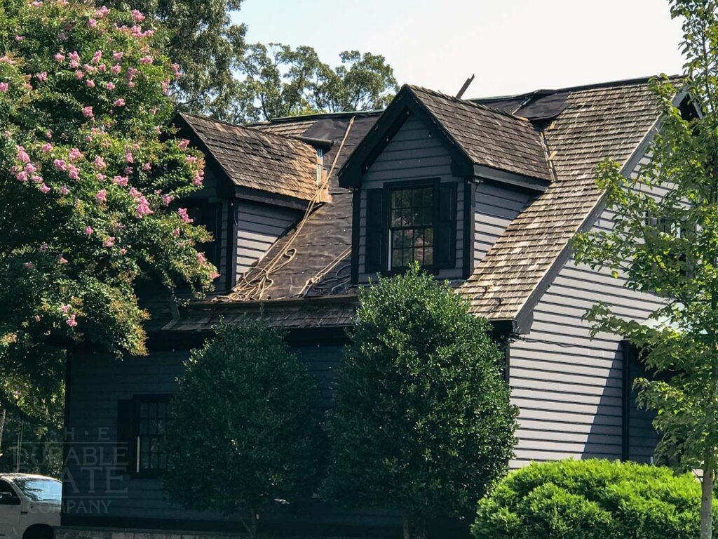 a house with trees in the background