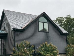 a house with trees in the background